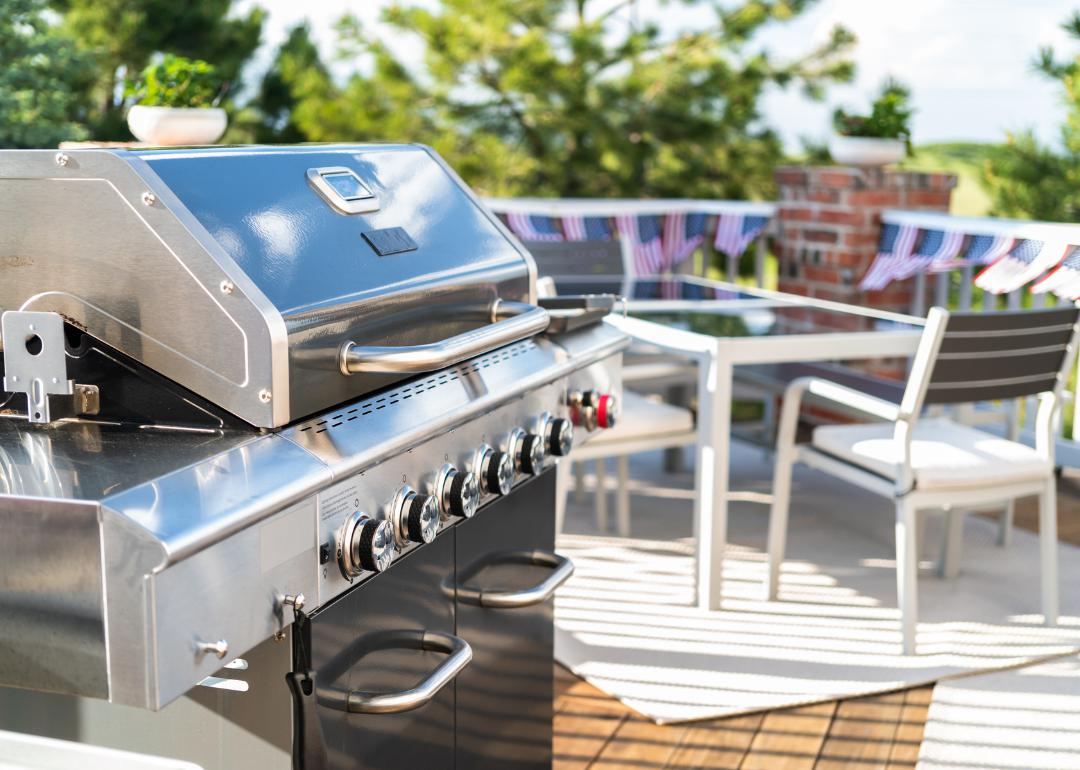 Stainless steel grill on backyard deck