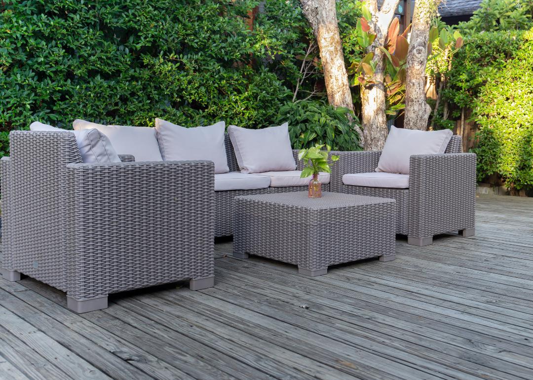 Patio furniture with outdoor sofa, chairs, and coffee table