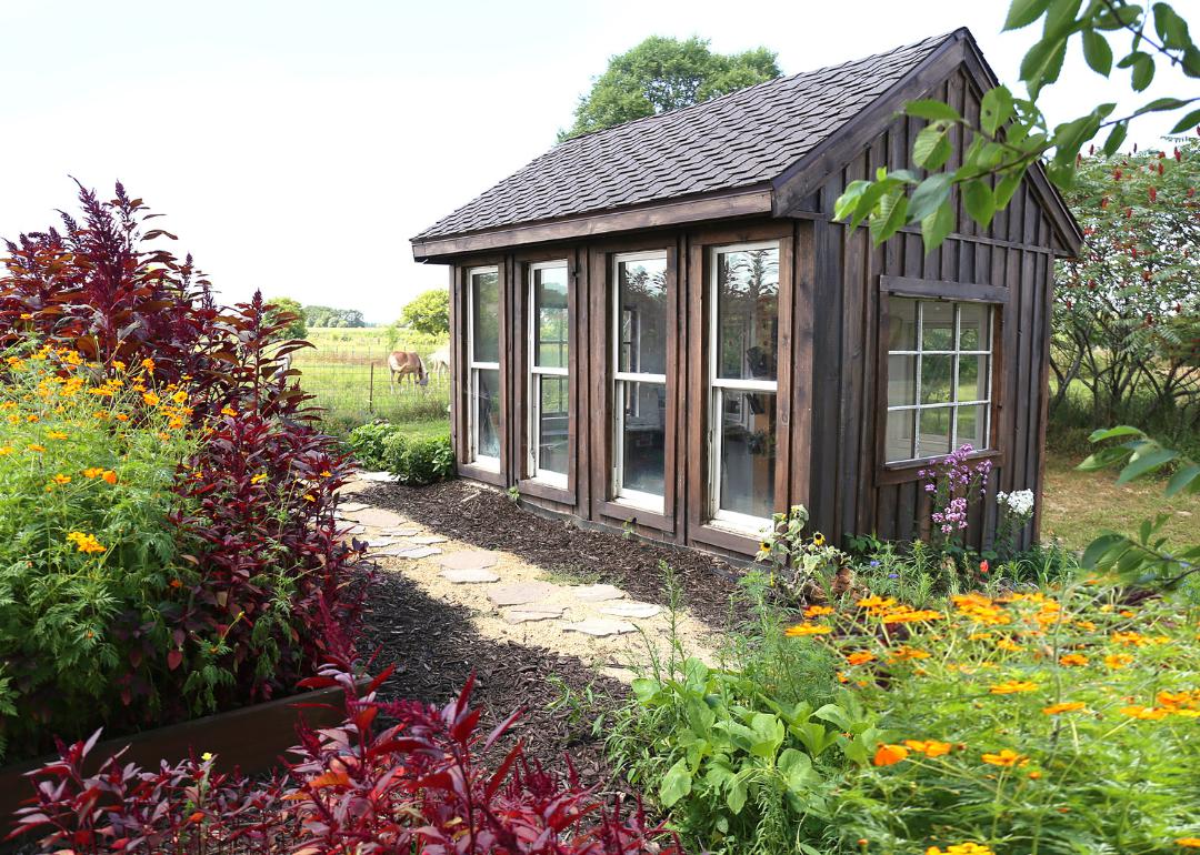 Outdoor shed with windows in backyard