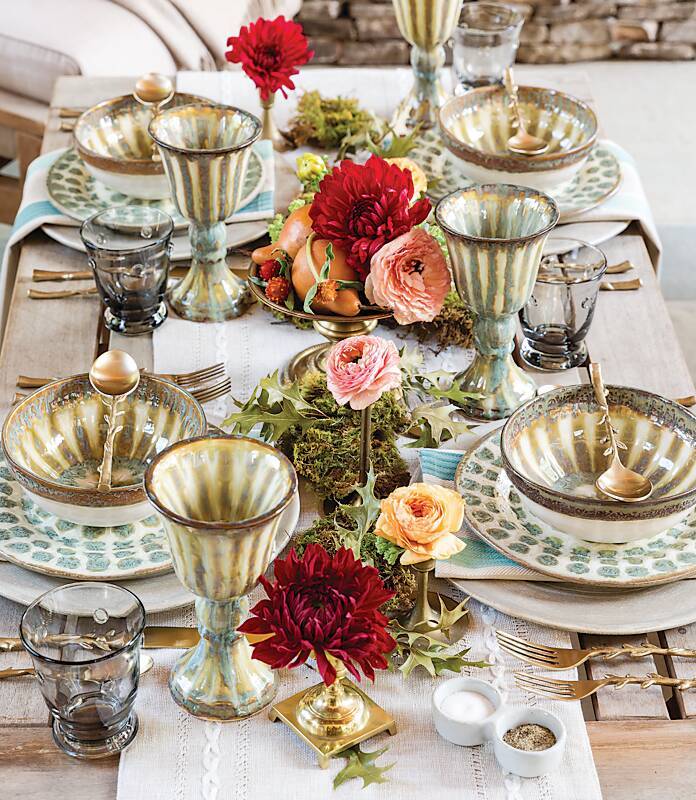 Ornate table setting with flowers, cups, and plates. Photo by Instagram user @southernladymag.