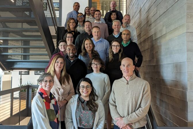Chairs of Extra Space Storage's Employee Resource Groups pose for group photo on stairs