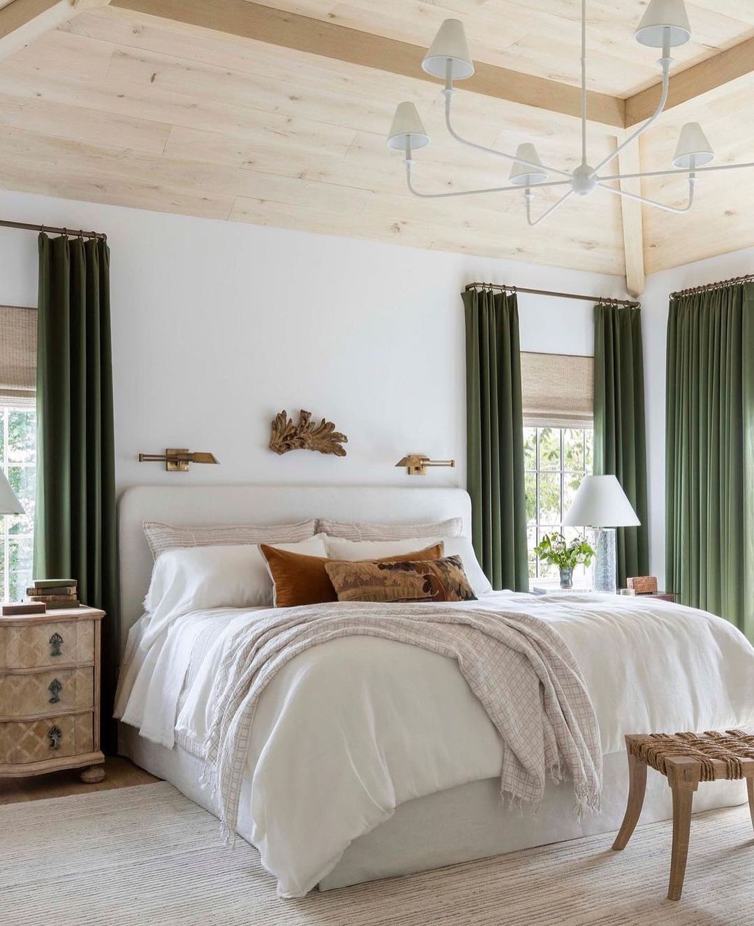 bedroom with green curtains and wooden ceiling. Photo by Instagram user @kathykuohome