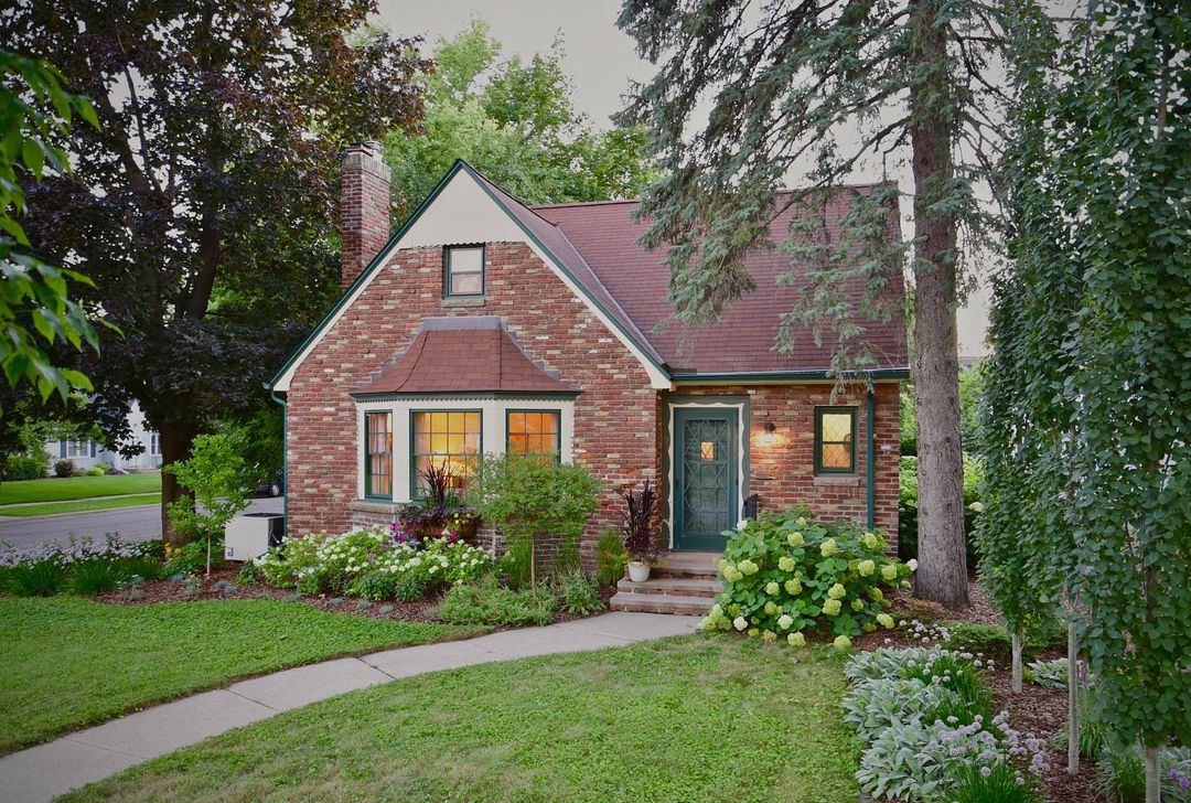 Pictured is a brick cottage home in Highland Park, St. Paul. Photo by Instagram username @andersonrealtymn
