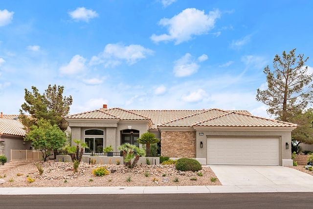 gray house with desert landscape. Photo via @betterliferealty