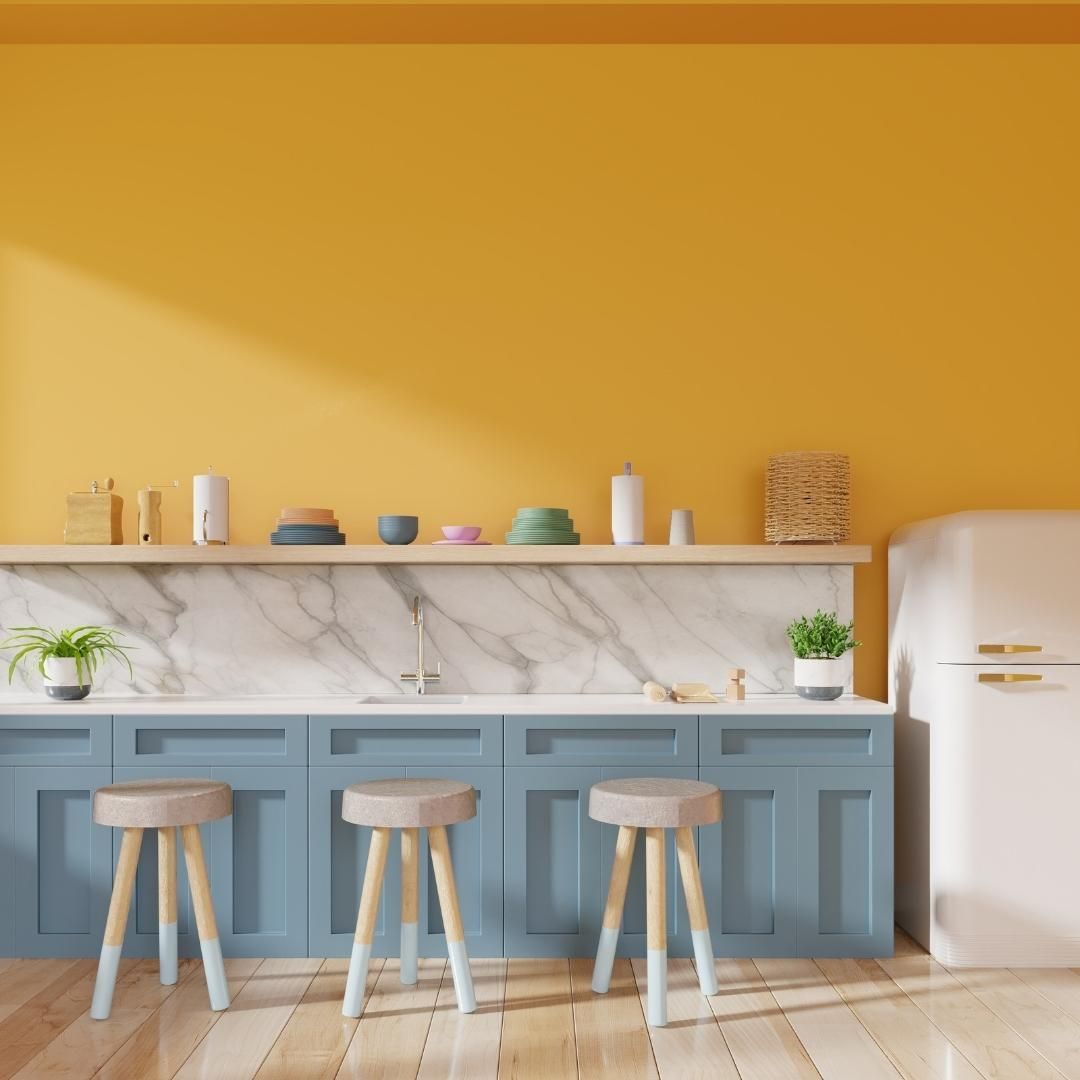 A dining area with vibrant yellow walls. Photo by Instagram user @fengshuifocus.