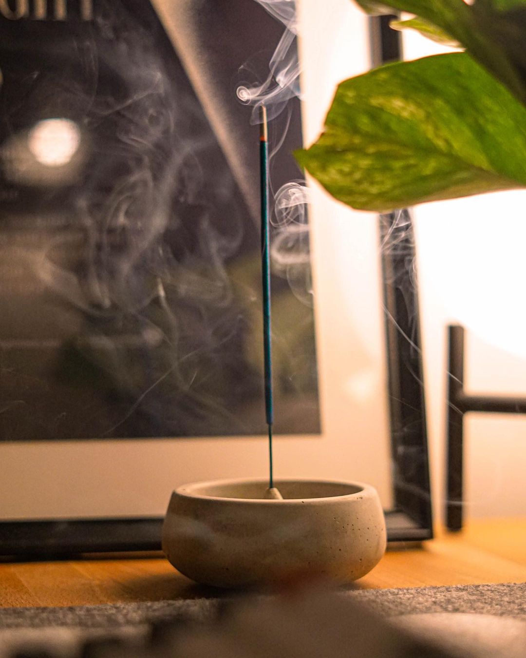 Incense burning in a clay holder on a desk. Photo by Instagram user @robert.mccombe