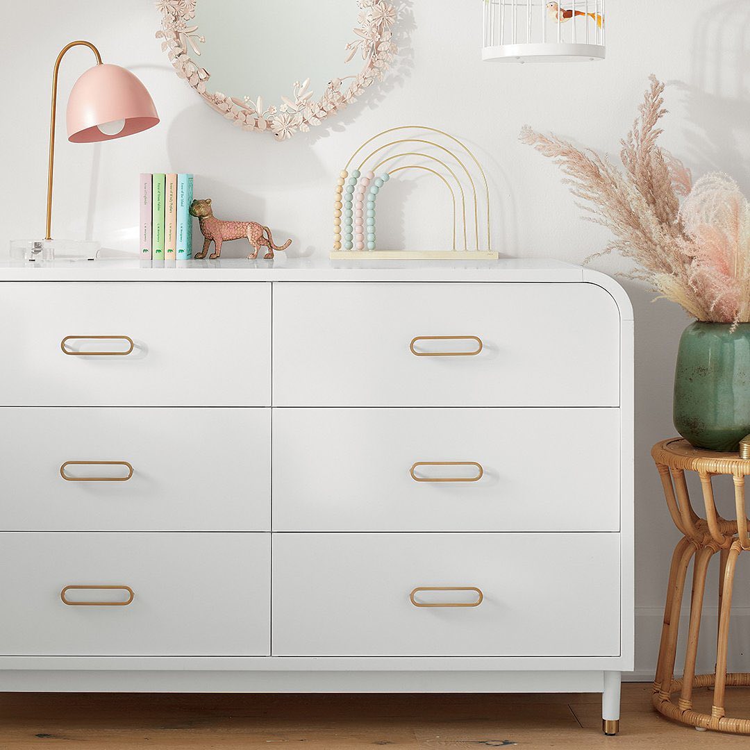 White Dresser with Gold, Modern Drawer Pulls. Photo by Instagram user @crateandkids