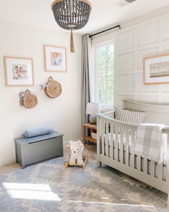 Light and bright nursery with a crib and rocking horse. Photo by Instagram user @montgofarmhouse.