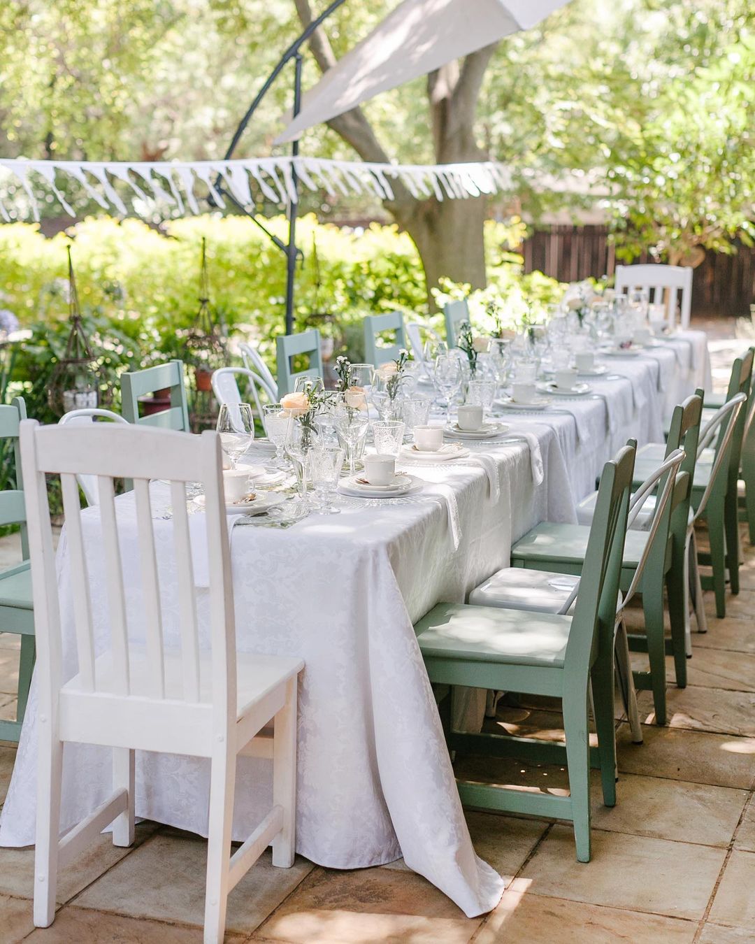 An outdoor table is set for guests. Photo by Instagram user @vintage_on_main.