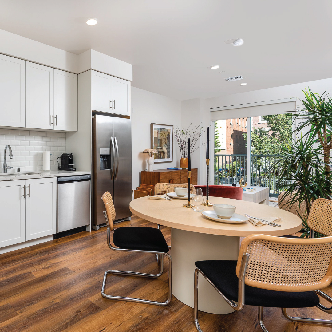 Spacious apartment dining room with round table and chairs. Photo by Instagram user @fedoraxtrilby.