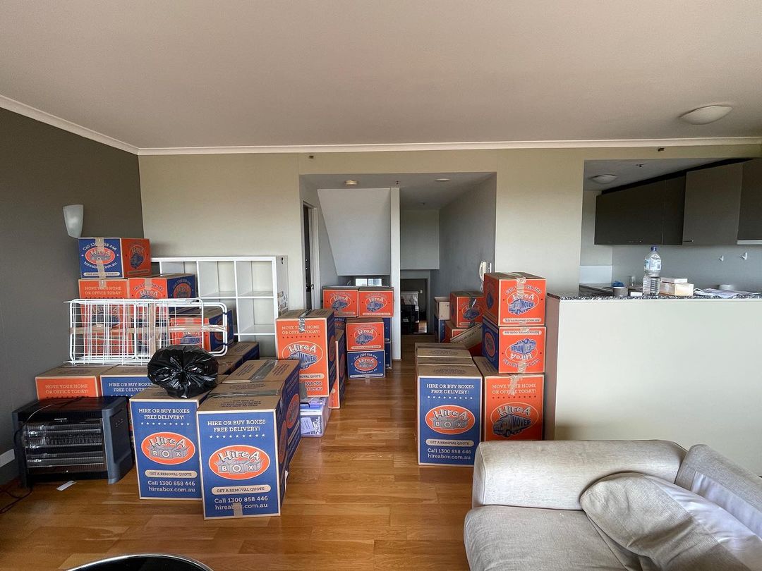 Apartment living room full of boxes ready to be moved. Photo by Instagram user @kensington25. 