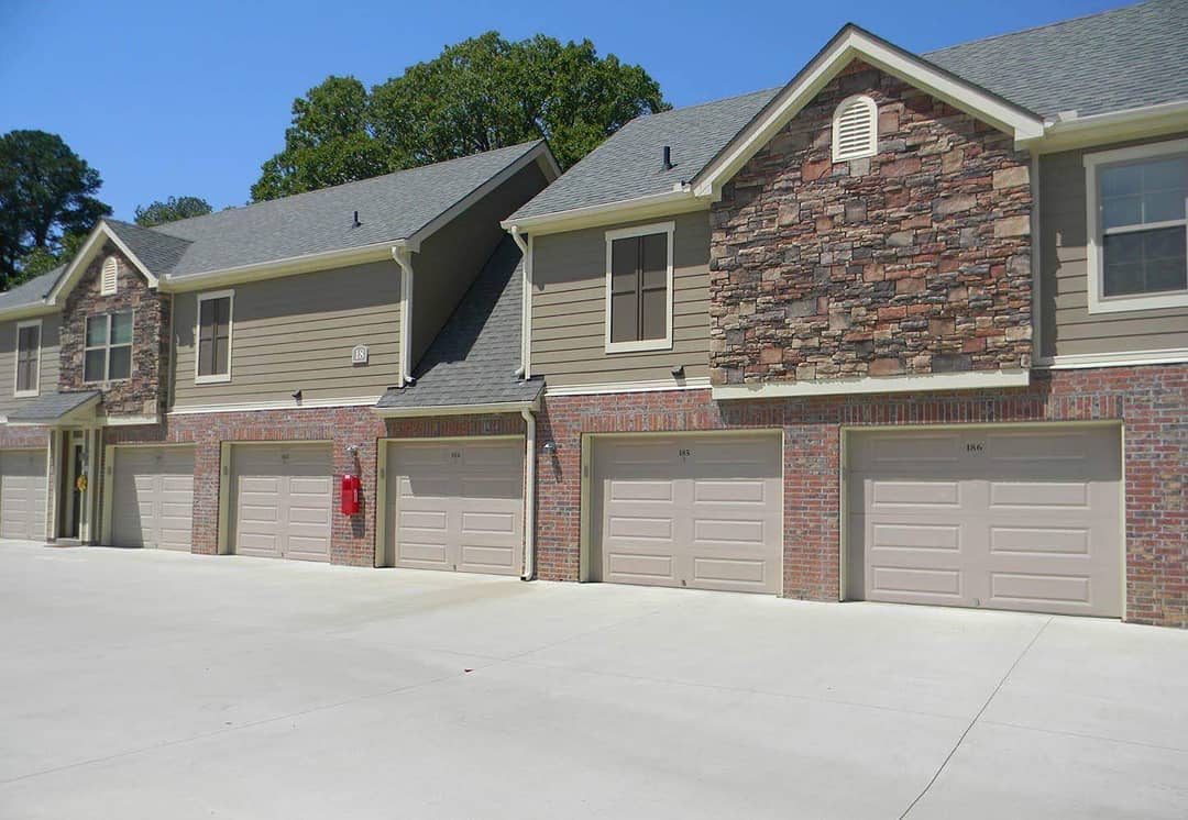 Row of personal garages at an apartment complex. Photo by Instagram user @centerstoneapartments.