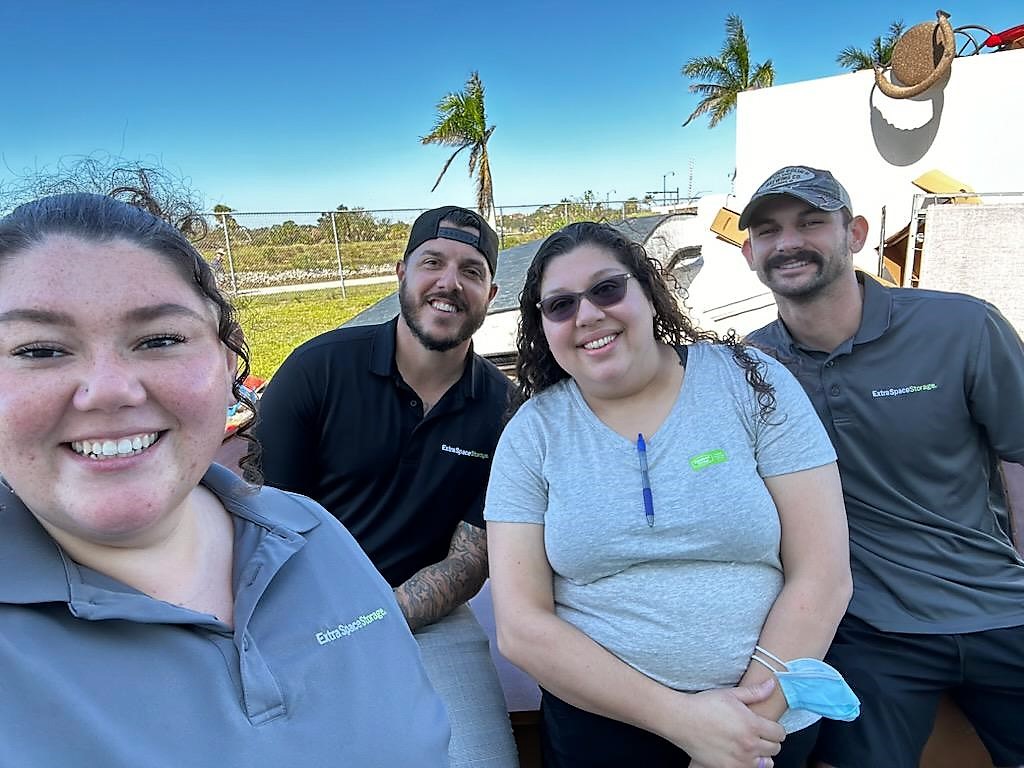 A group of 4 people who are a part of the hurricane Ian support team