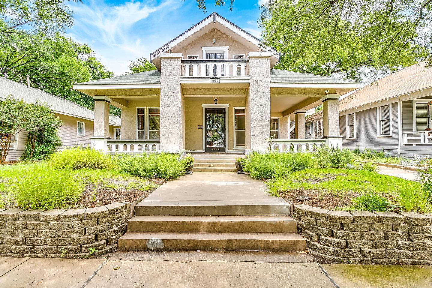 Pictured is a Prairie-style stucco home in Fairmount, Fort Worth. Photo by Instagram username @carleyjrealtor