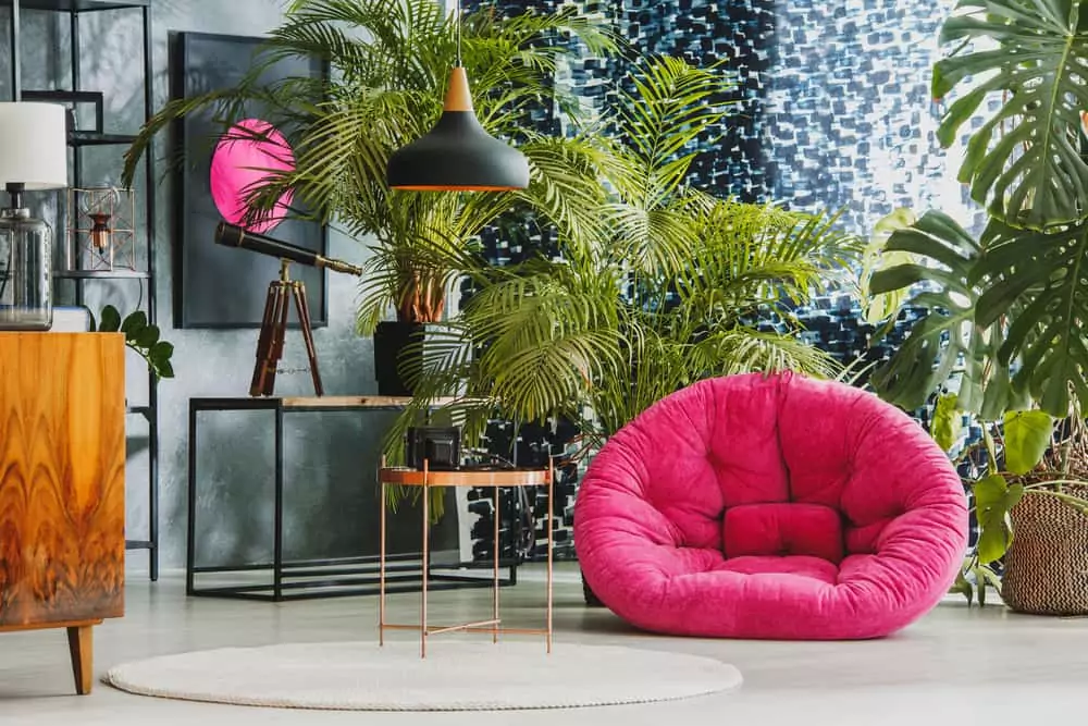 Pictured is a living room with a pink sofa.