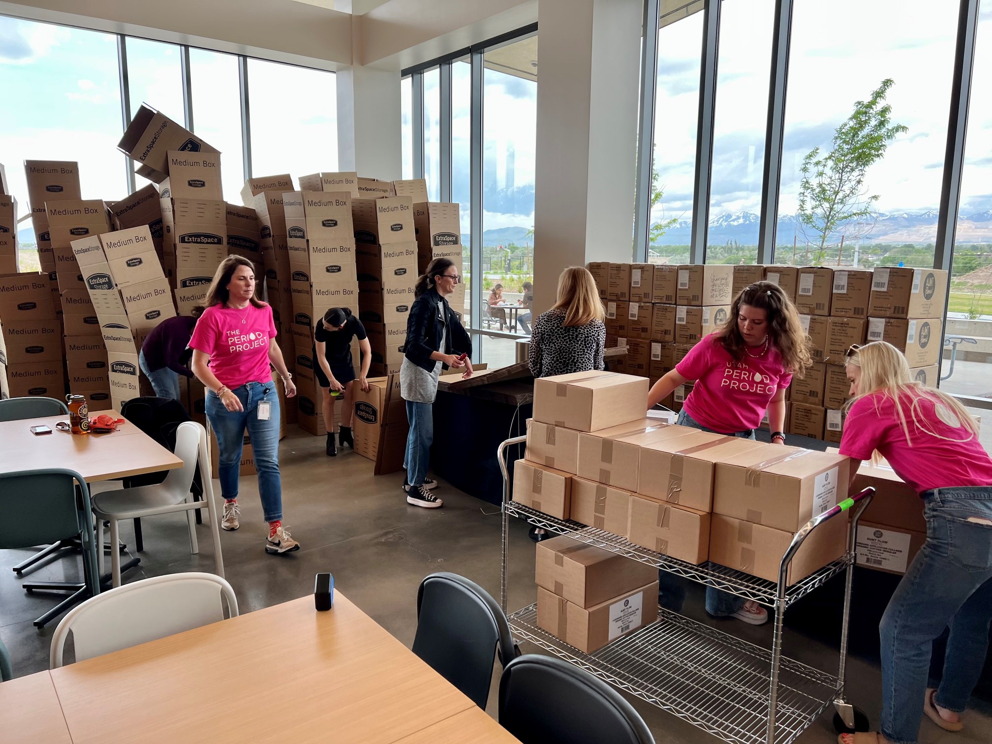 People working together and packaging Extra Space Storage boxes