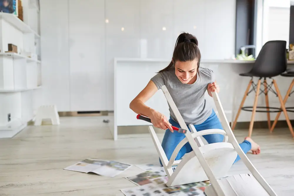 A woman works on chair.