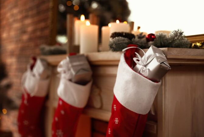 A festive Christmas mantel with stockings.