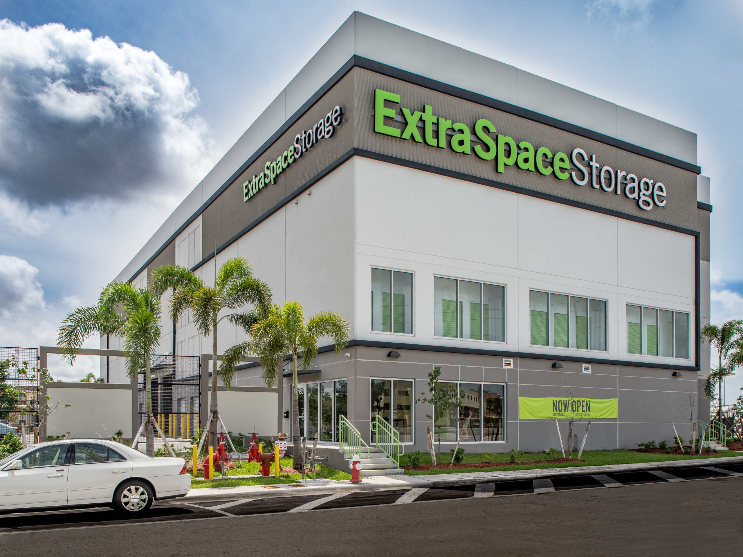 An Extra Space Storage facility with a sign that says "Now Open"