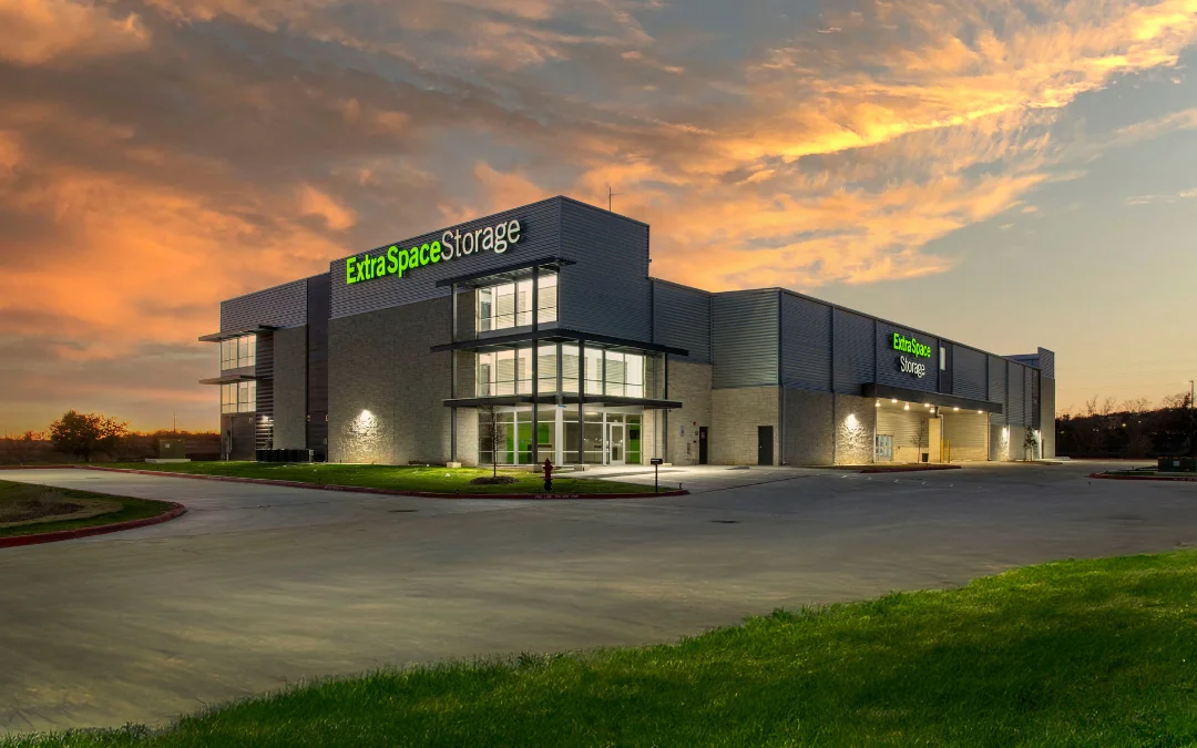 Multi-story storage facility on 328 Center Point Rd with Extra Space Storage logo illuminated on building at dusk