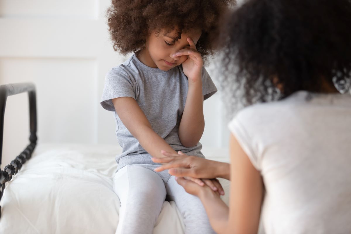 A woman comforting a child