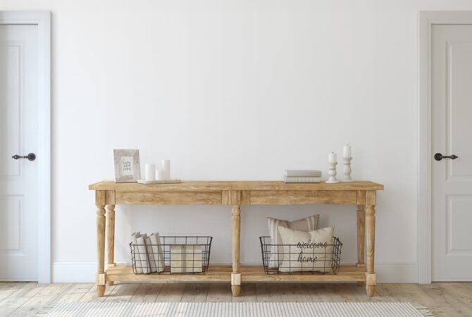 Photo shows an example of a console table with baskets placed underneath on the shelves.