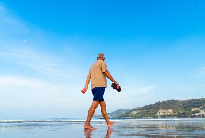 person walking the beach