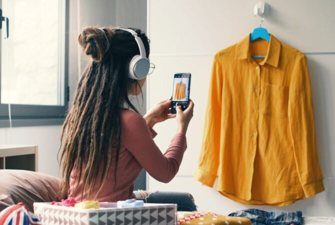A woman photographing a shirt