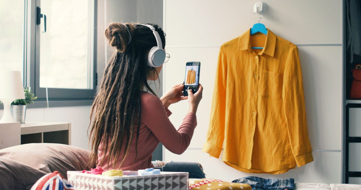 A woman photographing a shirt