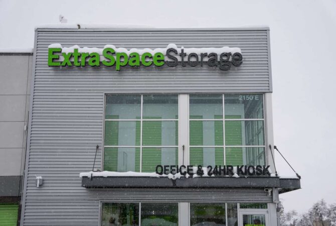 A Extra Space Storage building that is lightly covered in snow.