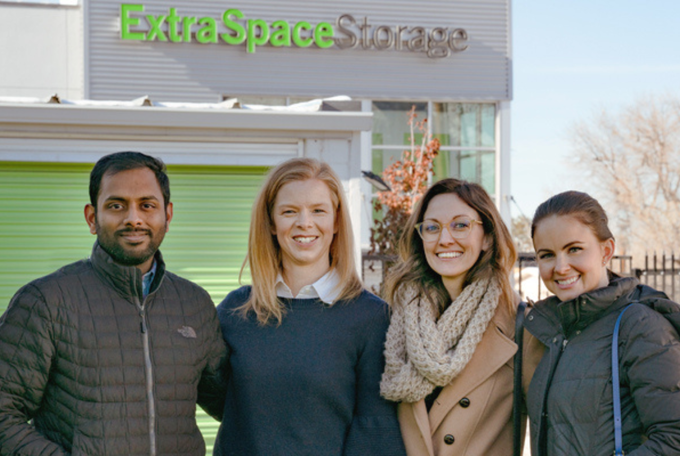 Extra Space Storage employees in front of self storage facility