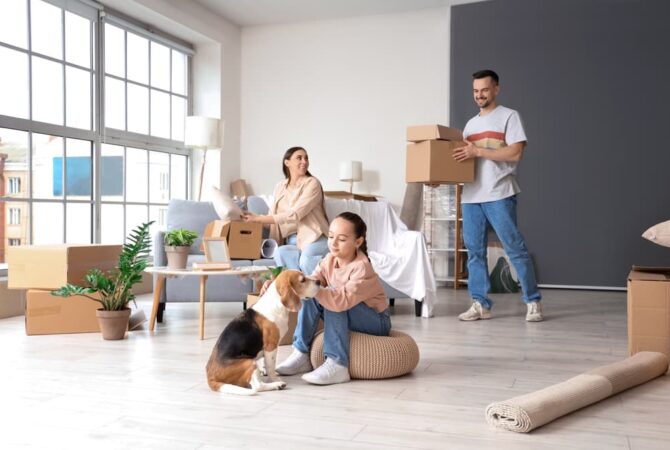 family unloading boxes into their new 2 bedroom apartment