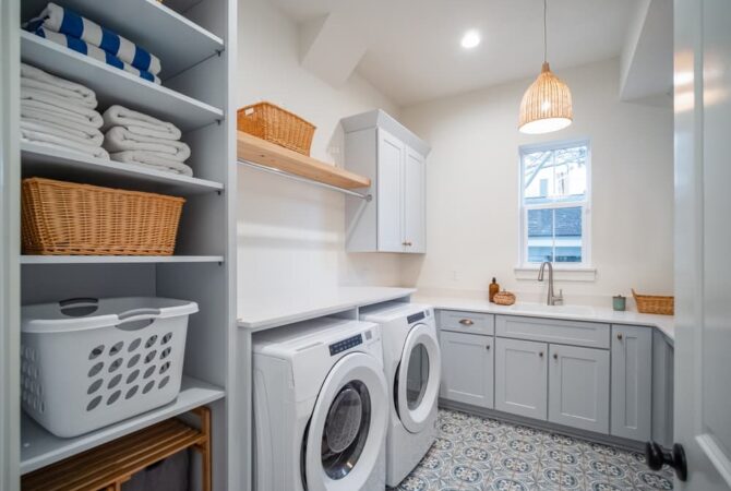 An inside look of a laundry room with a washer and dryer.