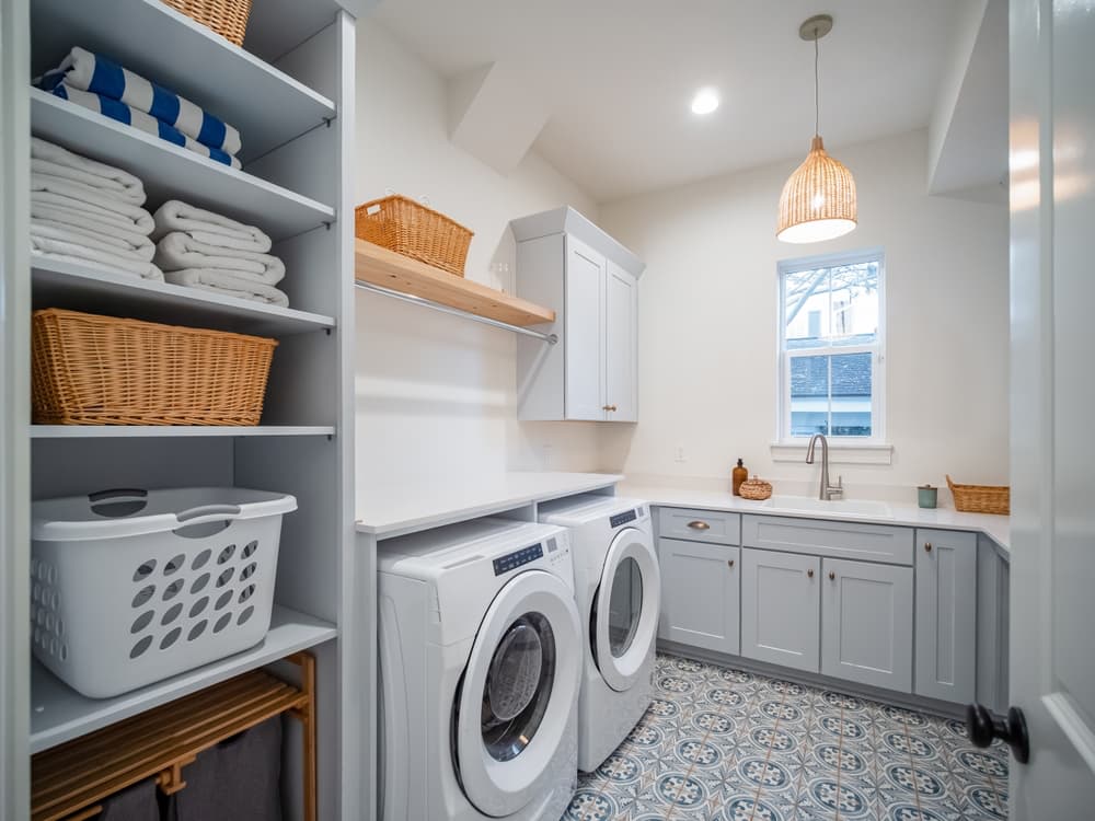 An inside look of a laundry room with a washer and dryer.