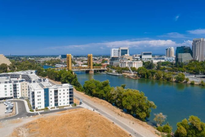 skyline of Sacramento, CA with views of a bridge and downtown Sac