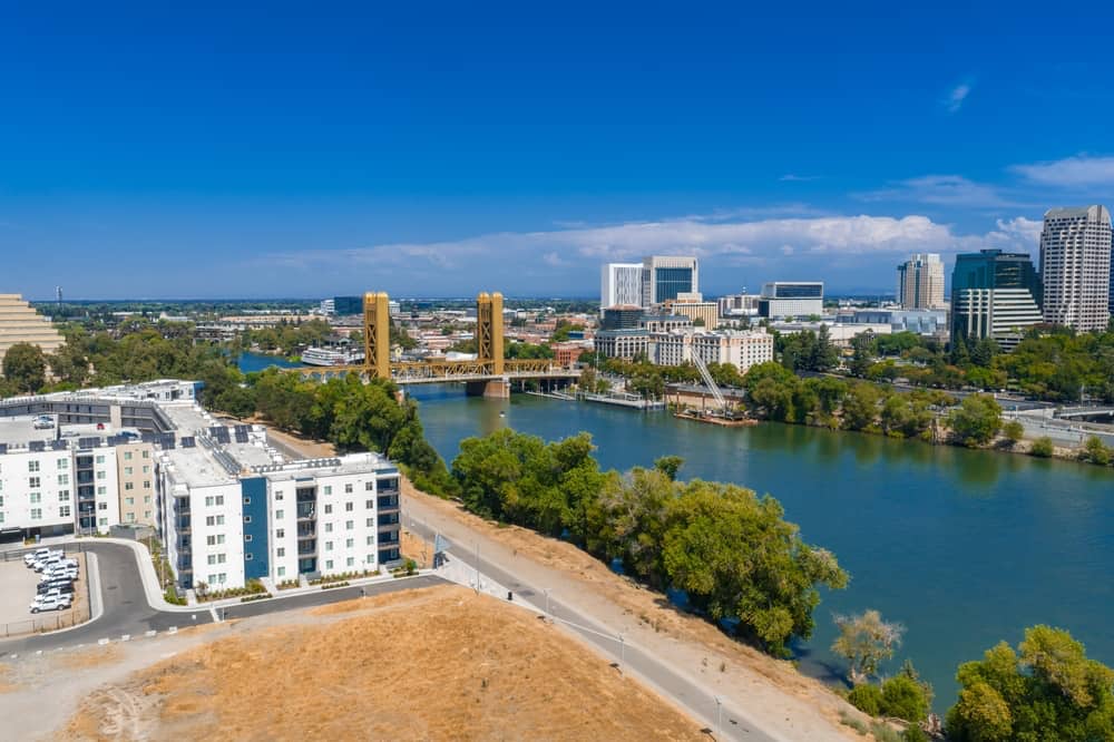 skyline of Sacramento, CA with views of a bridge and downtown Sac