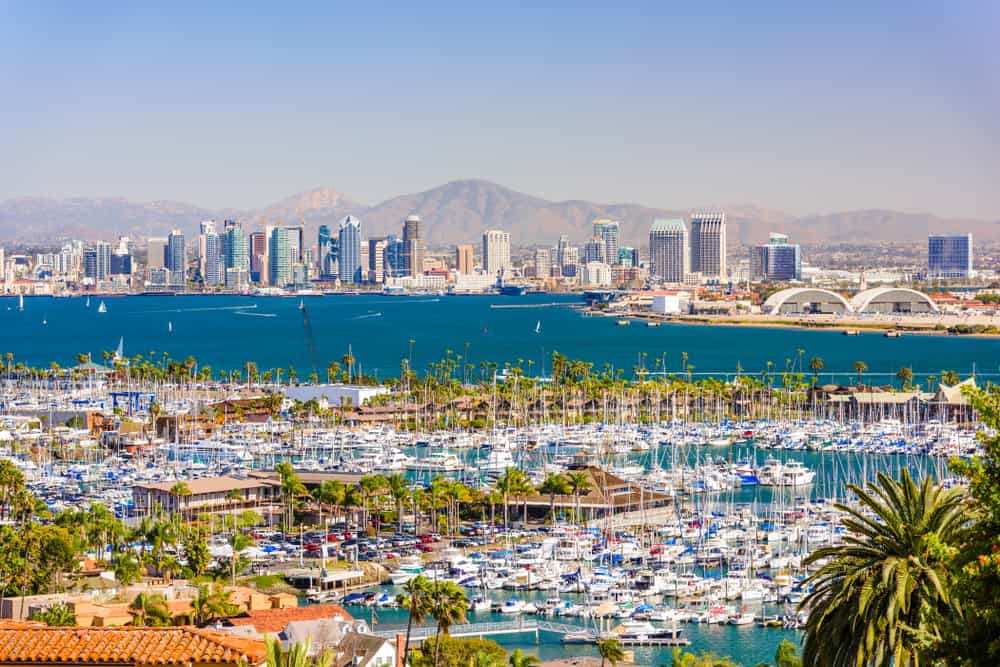 Skyline views of san diego, CA with pier and mountain view