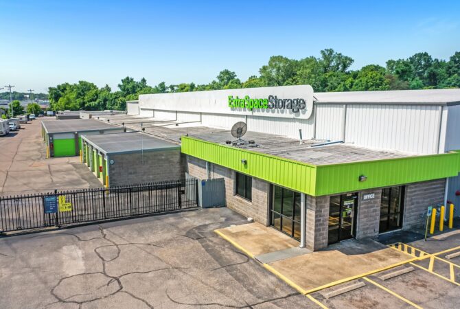 Aerial image of an Extra Space Storage facility in Memphis, TN during daytime, featuring clear blue skies.